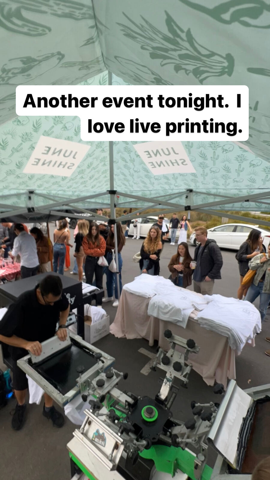 Close-up of stacked custom t-shirts with printed text on a display table